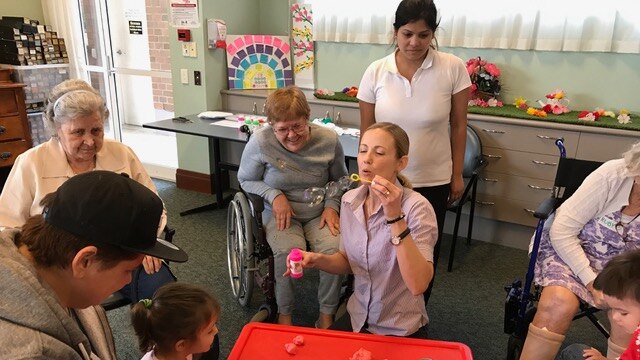 Residents at Brisbane aged care facility share playgroup with young children