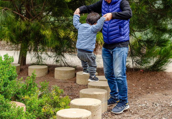 A father playing with his son outside